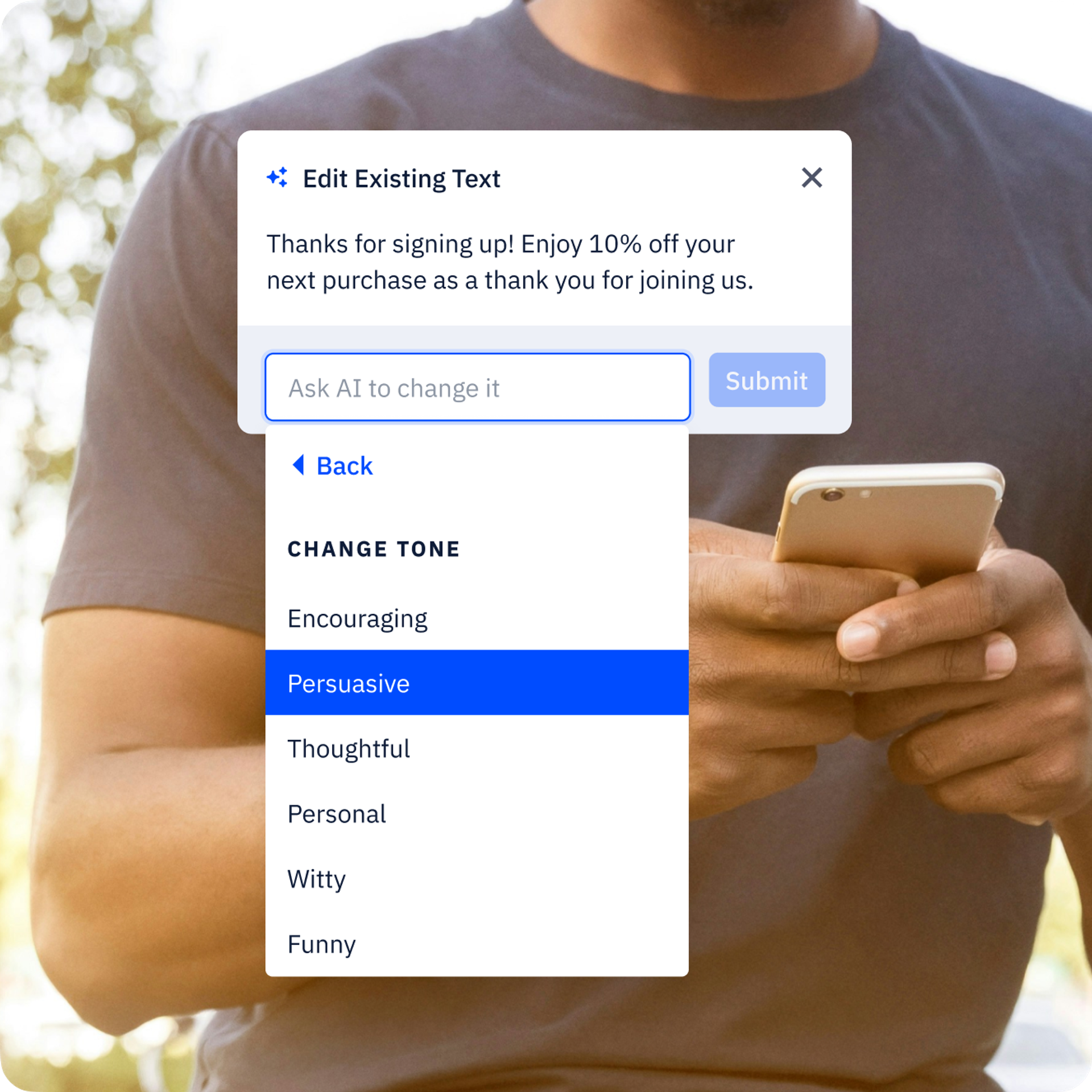 A male-presenting person using a cellphone outdoors. Overlaid is a box where a user can select the right tone for their email using generative AI tools.
