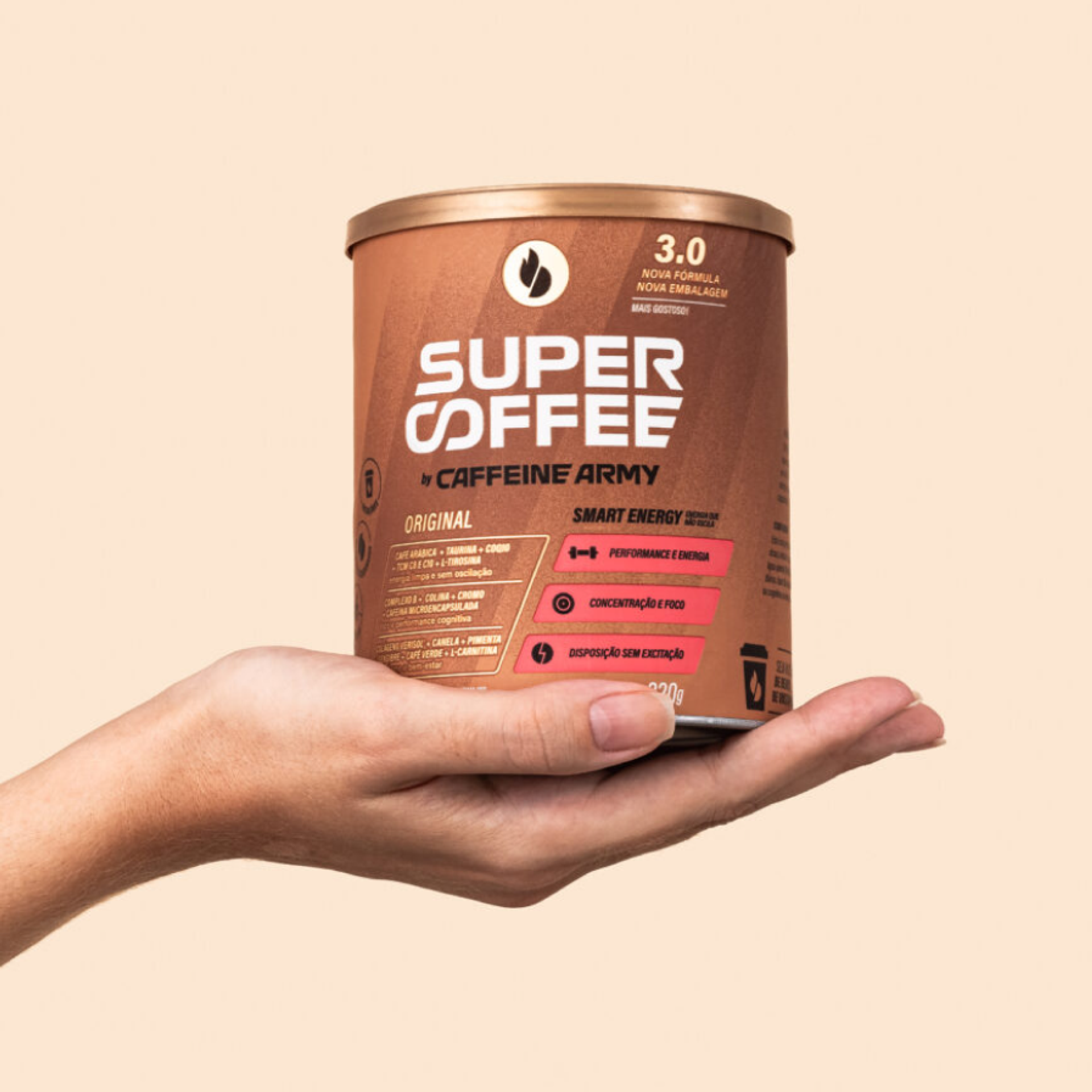 A hand holding a tub of Caffeine Army Super Coffee grounds.