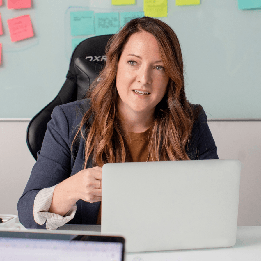 A woman in a meeting, surrounded by post-it notes and productive ideas.