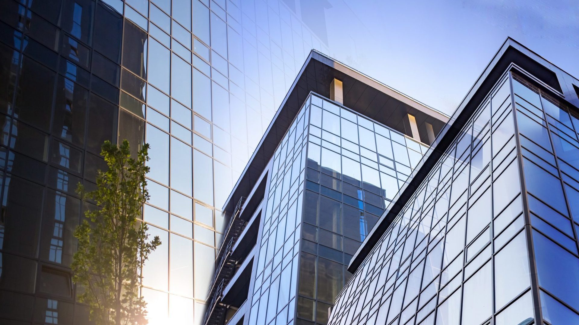 Abstract business modern city urban futuristic architecture background. Real estate concept, motion blur, reflection in glass of high rise skyscraper facade.