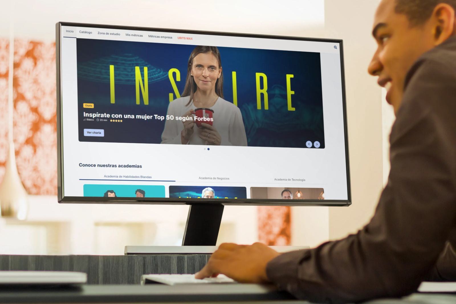 A student watches a video from an e-learning course on a desktop computer