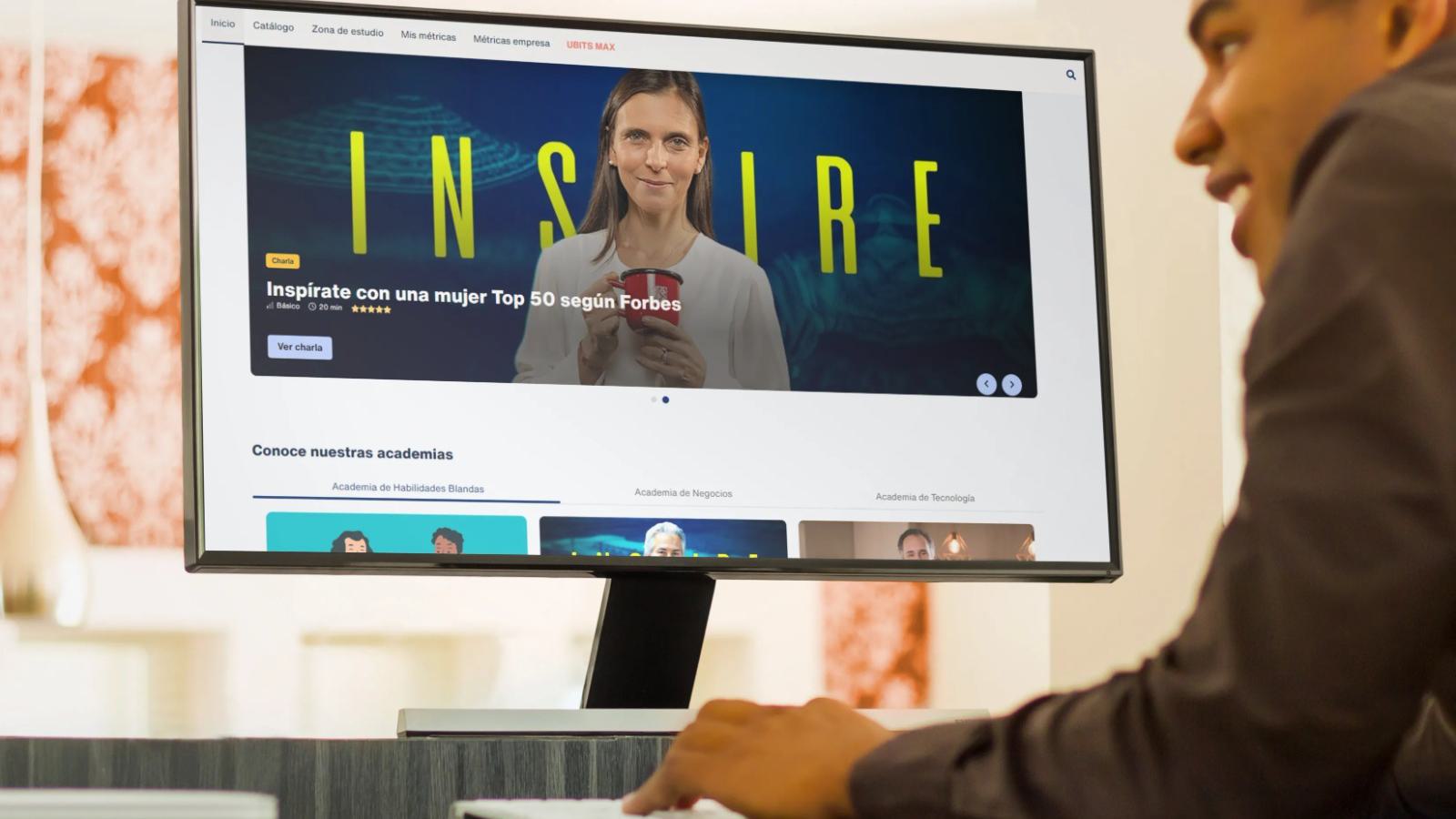 A student watches a video from an e-learning course on a desktop computer