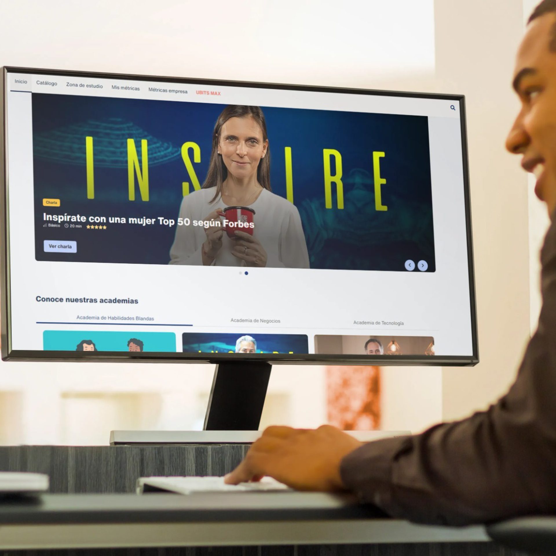 A student watches a video from an e-learning course on a desktop computer