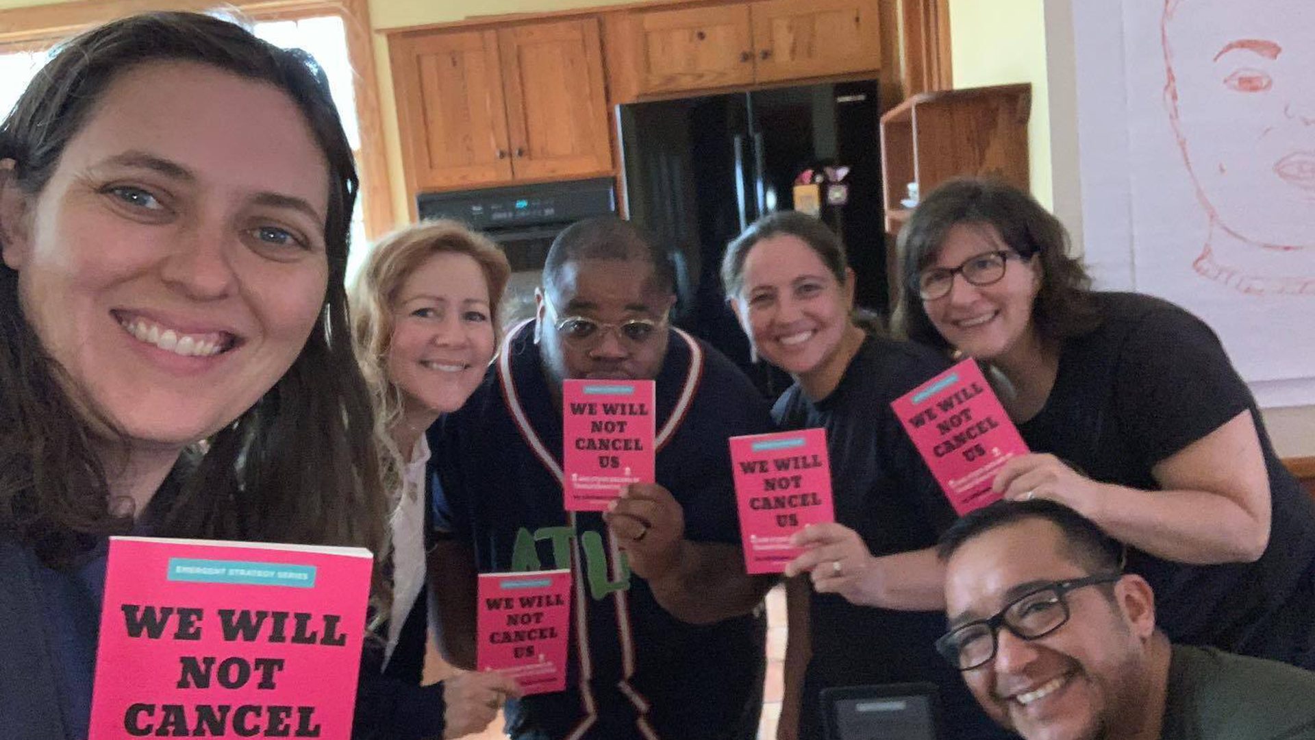 The UNHUSHED board poses for a group photo