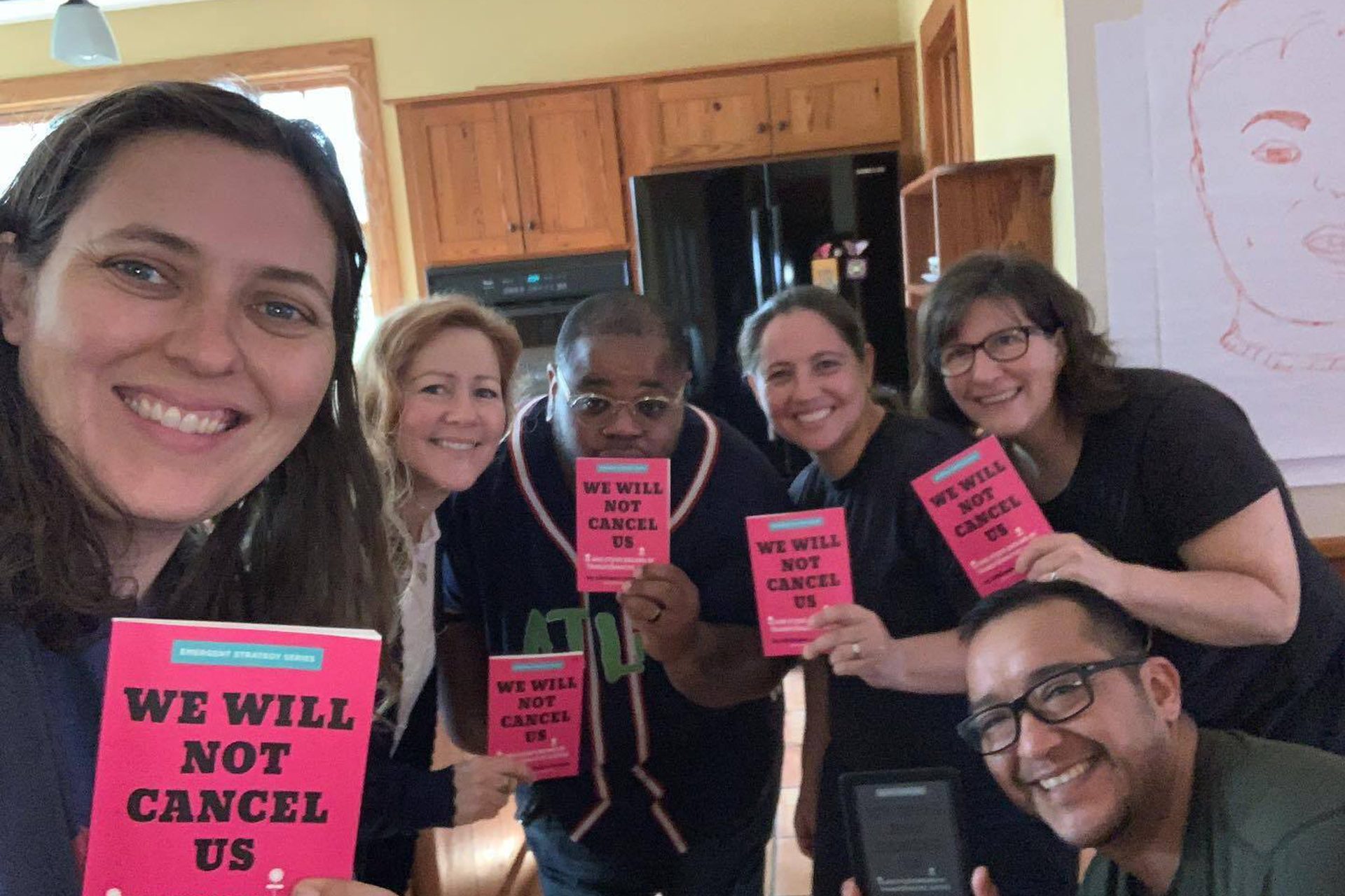 The UNHUSHED board poses for a group photo